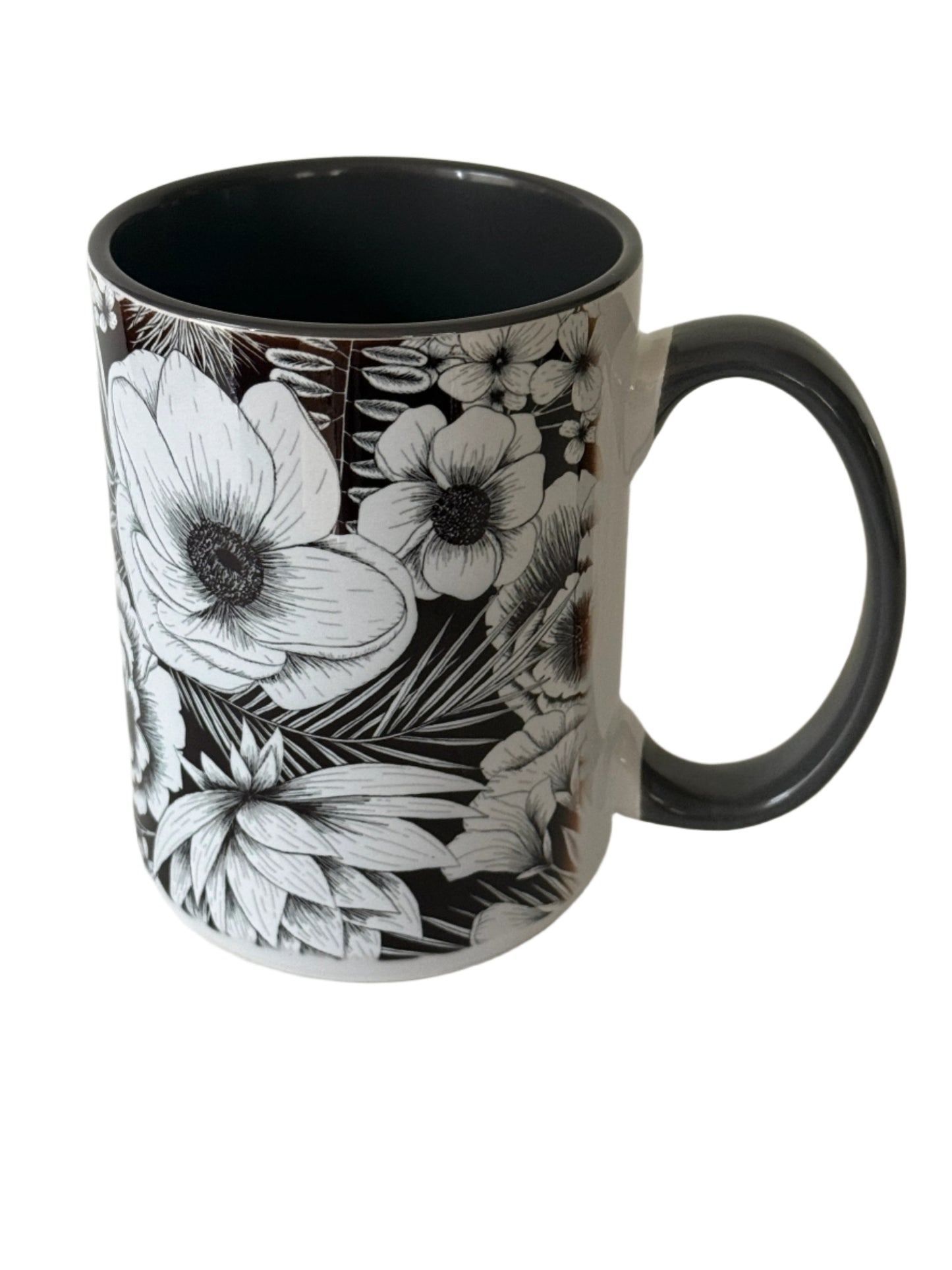 Beautiful 15 oz mug with black and white botanical flower. Mug has a gray interior and gray handle.