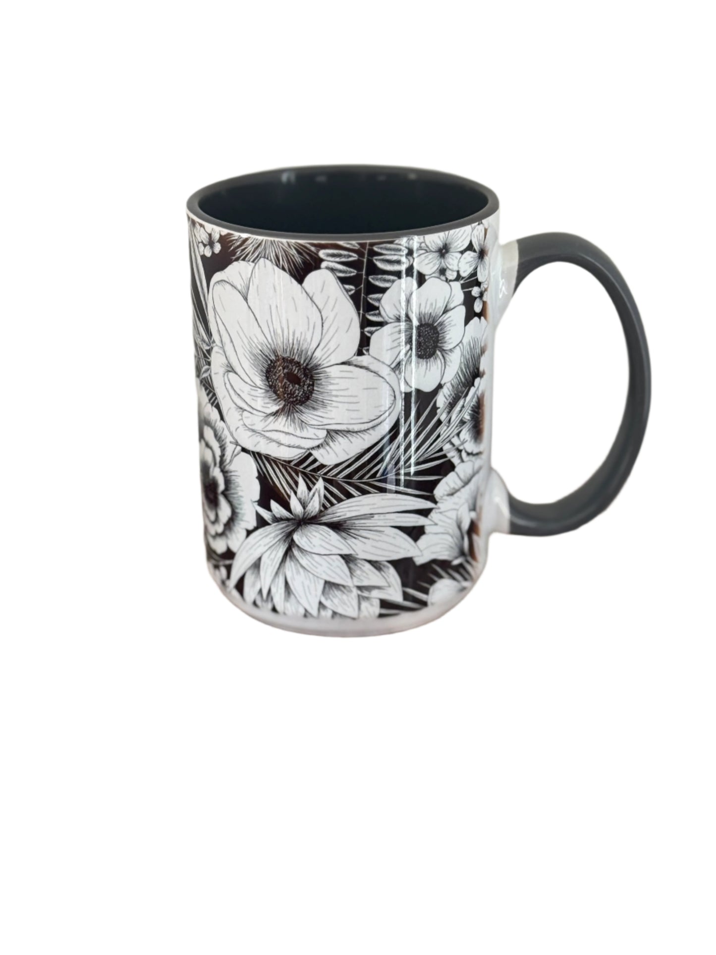 Beautiful 15 oz mug with black and white botanical flower. Mug has a gray interior and gray handle.