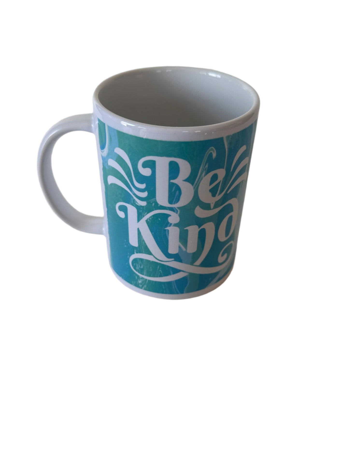 Right side view of "Be Kind' ceramic coffee mug in blue and green with white handle Roxzell
