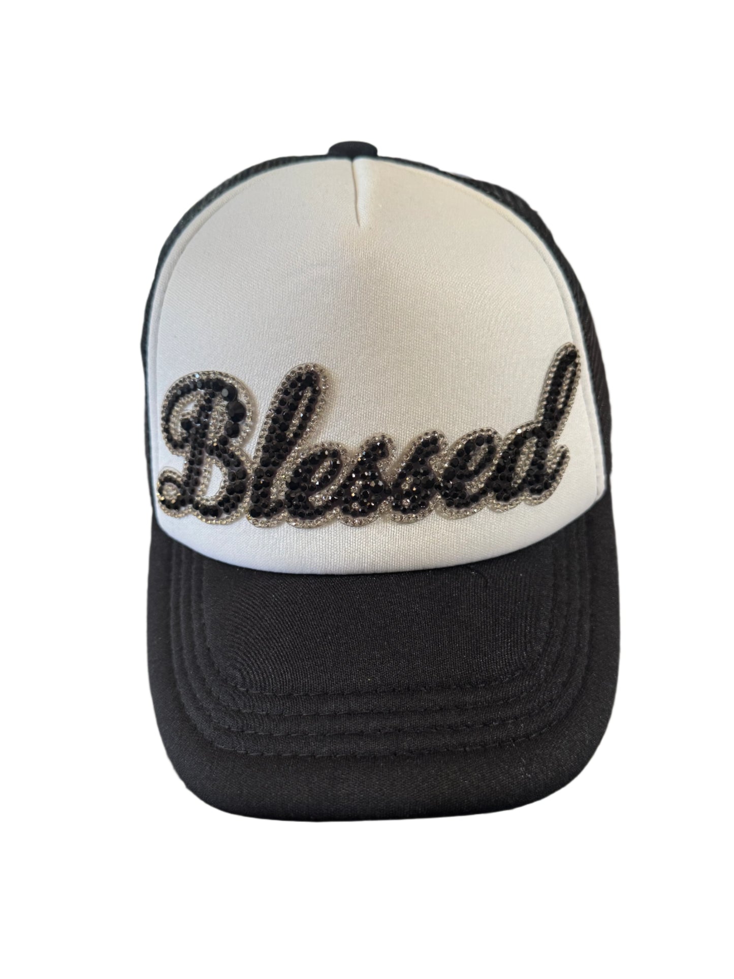 Black and white baseball cap with bejeweled "Blessed" design on the front.