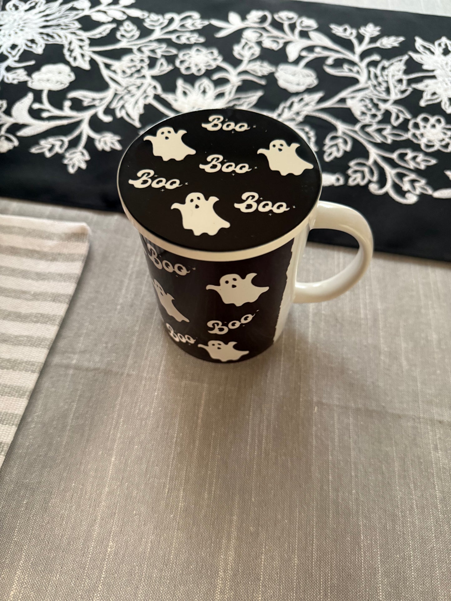Black and white Halloween mug with Ghost and "Boo" text design with matching coaster used to cover to of mug, Roxzell