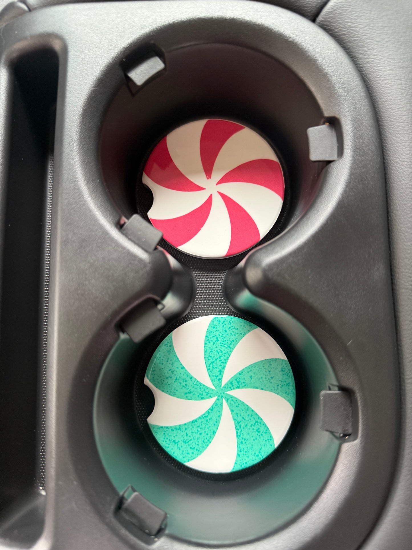 Two peppermint-themed car coasters in car cup holders Roxzell