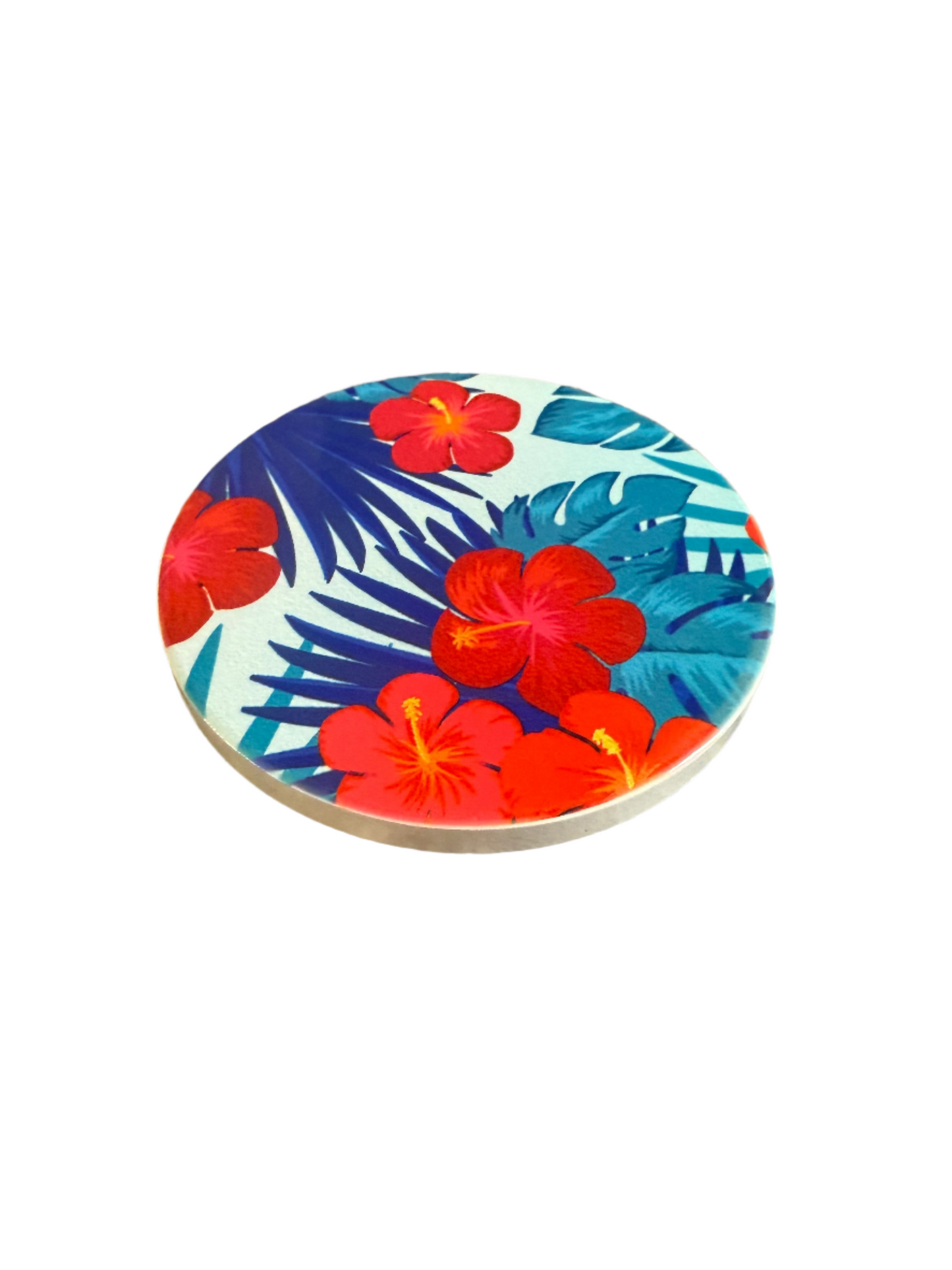 Round handcrafted coaster with tropical floral design on a white background