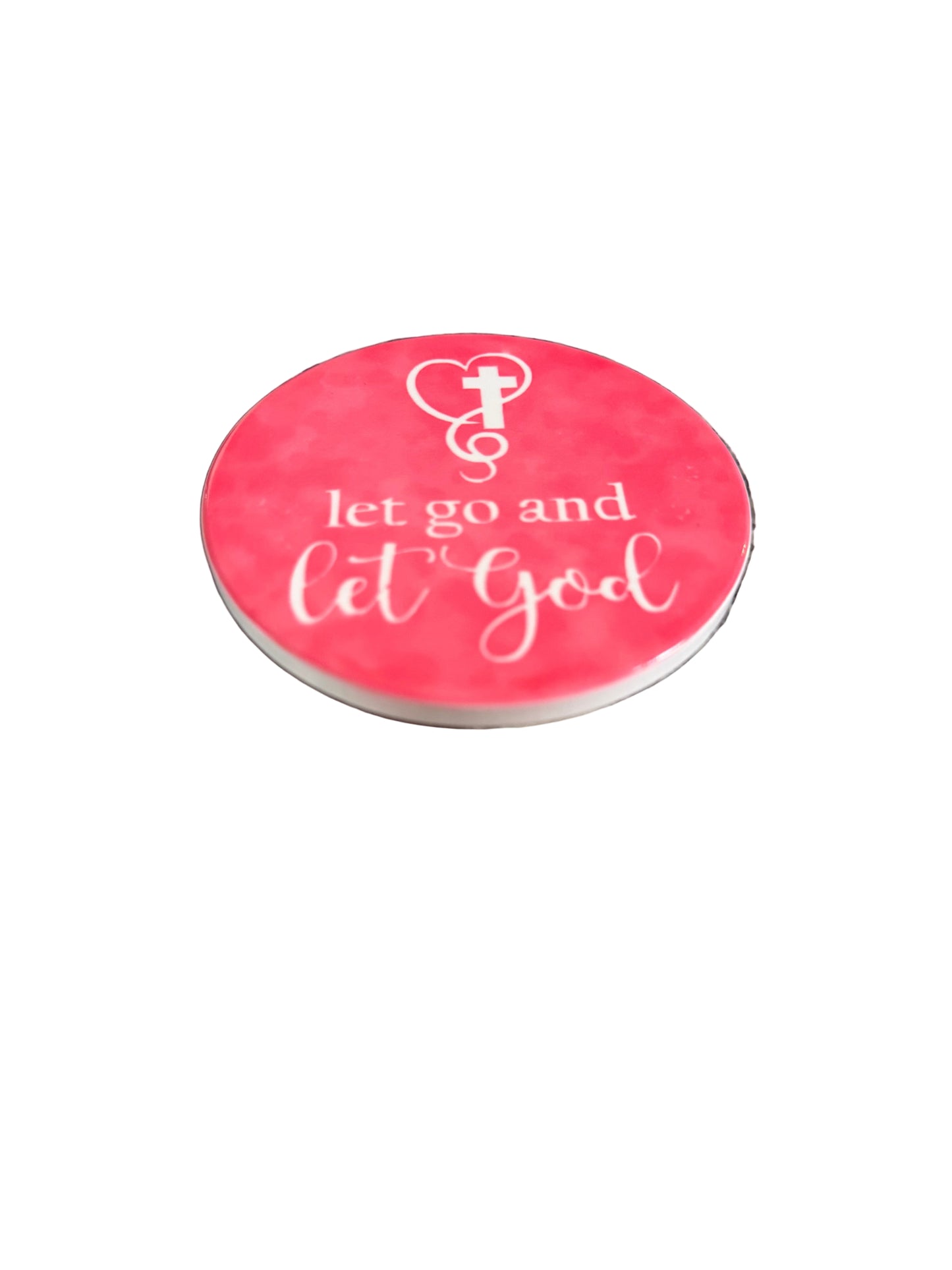 Round bright pink coaster with 'let go and let God' text and cross surrounded by a heart Roxzell
