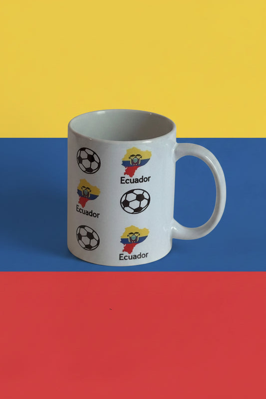 White ceramic mug featuring Ecuador map outlines in flag colors with national emblem and soccer ball motifs, representing Ecuadorian football pride. Roxzell