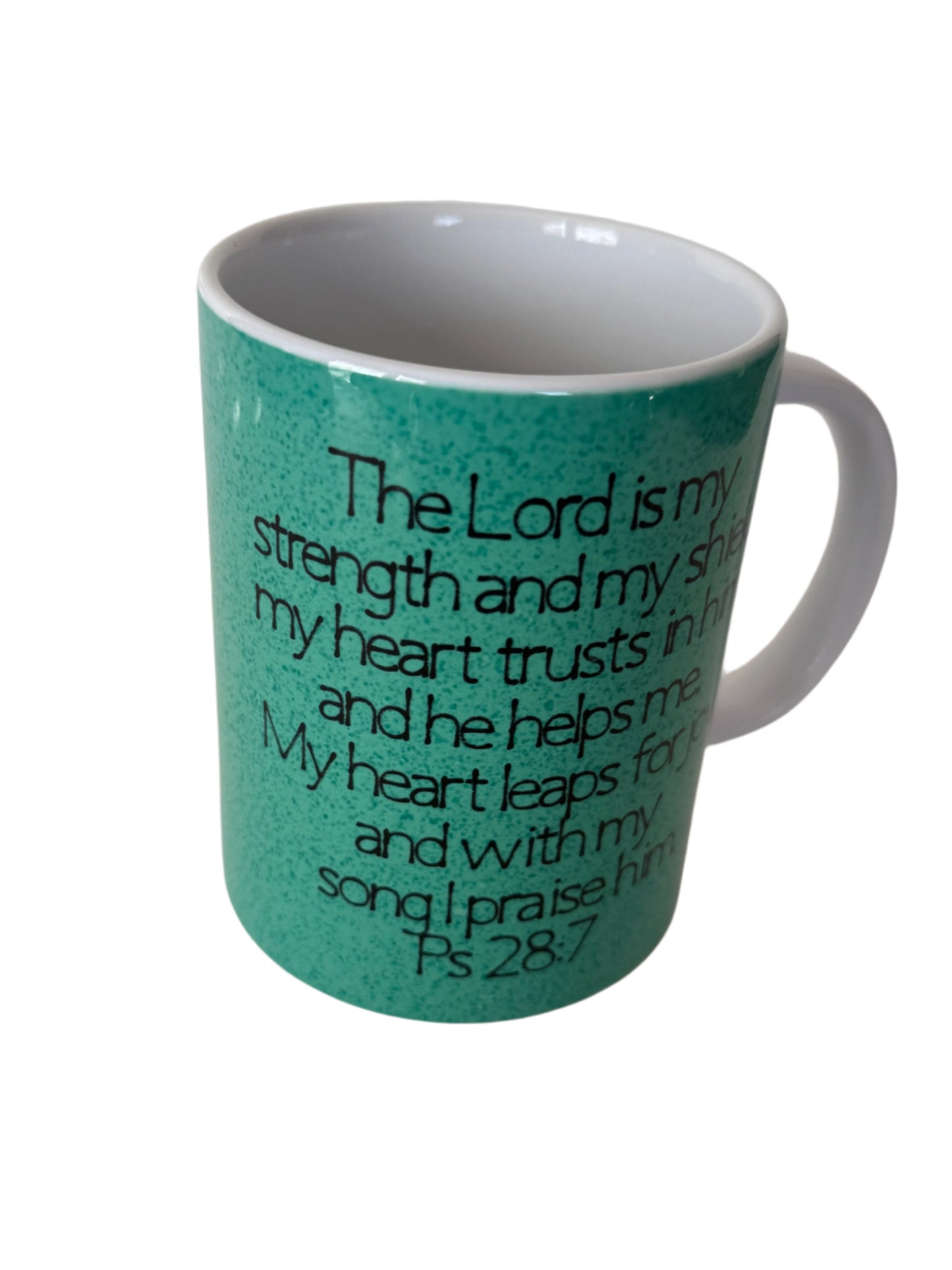 A green ceramic coffee/tea mug with the word 'JOY' written on it, displayed with a white background.