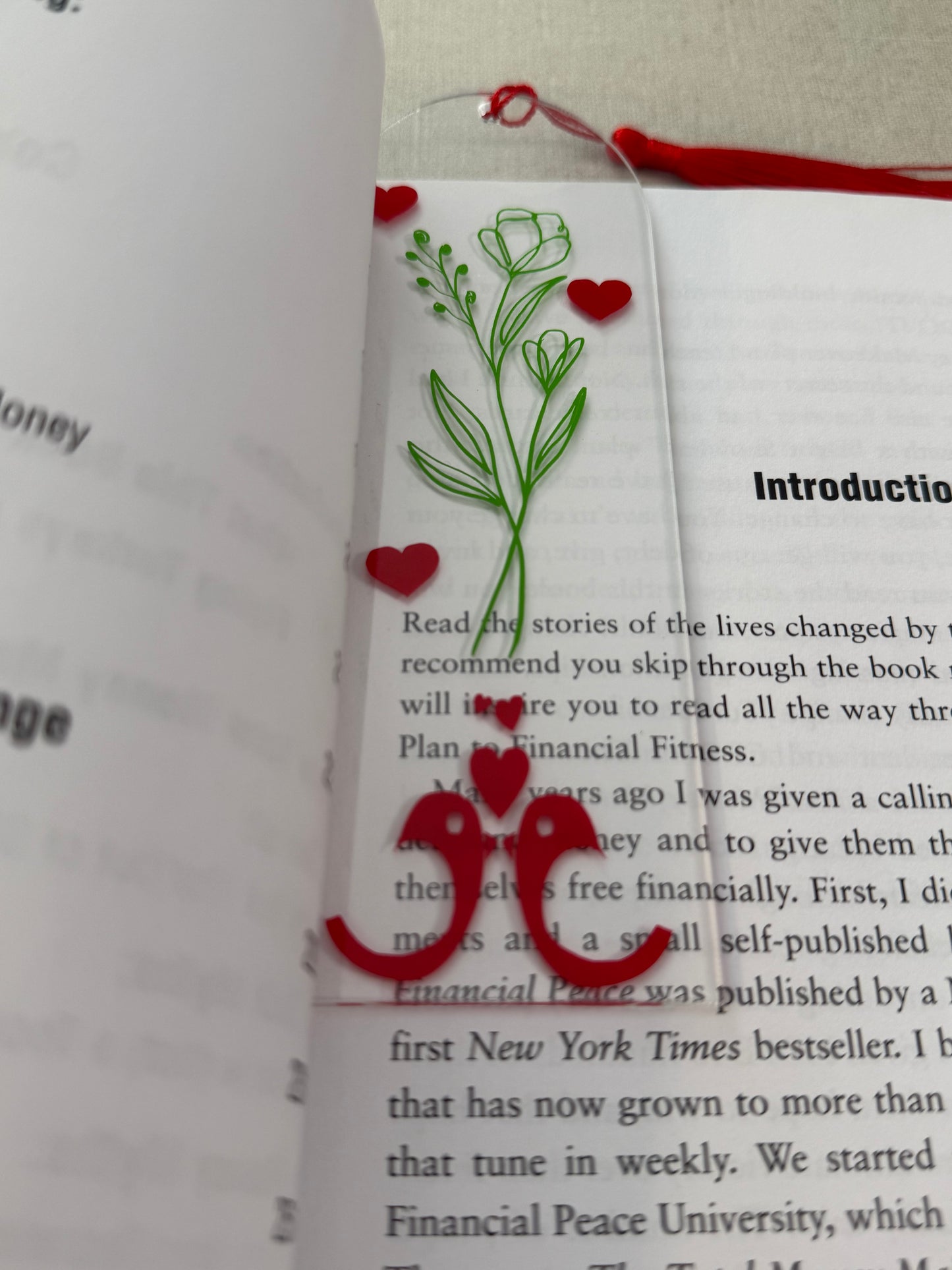 Acrylic bookmark with green flowers, red love birds, and a red tassel Roxzell