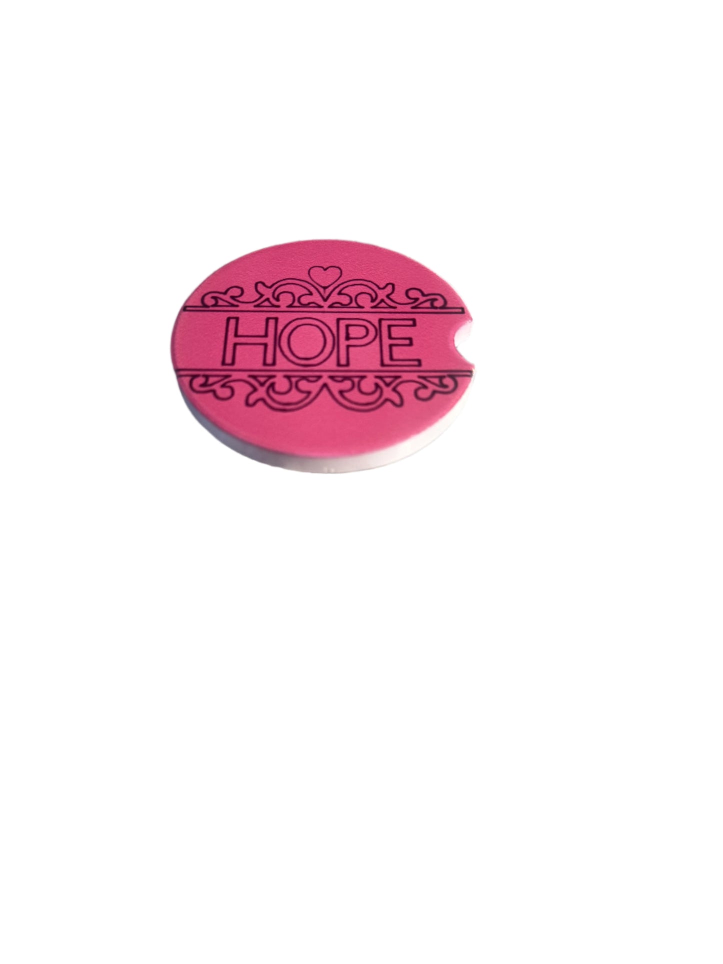 Pink 'HOPE' car coaster on a white background.