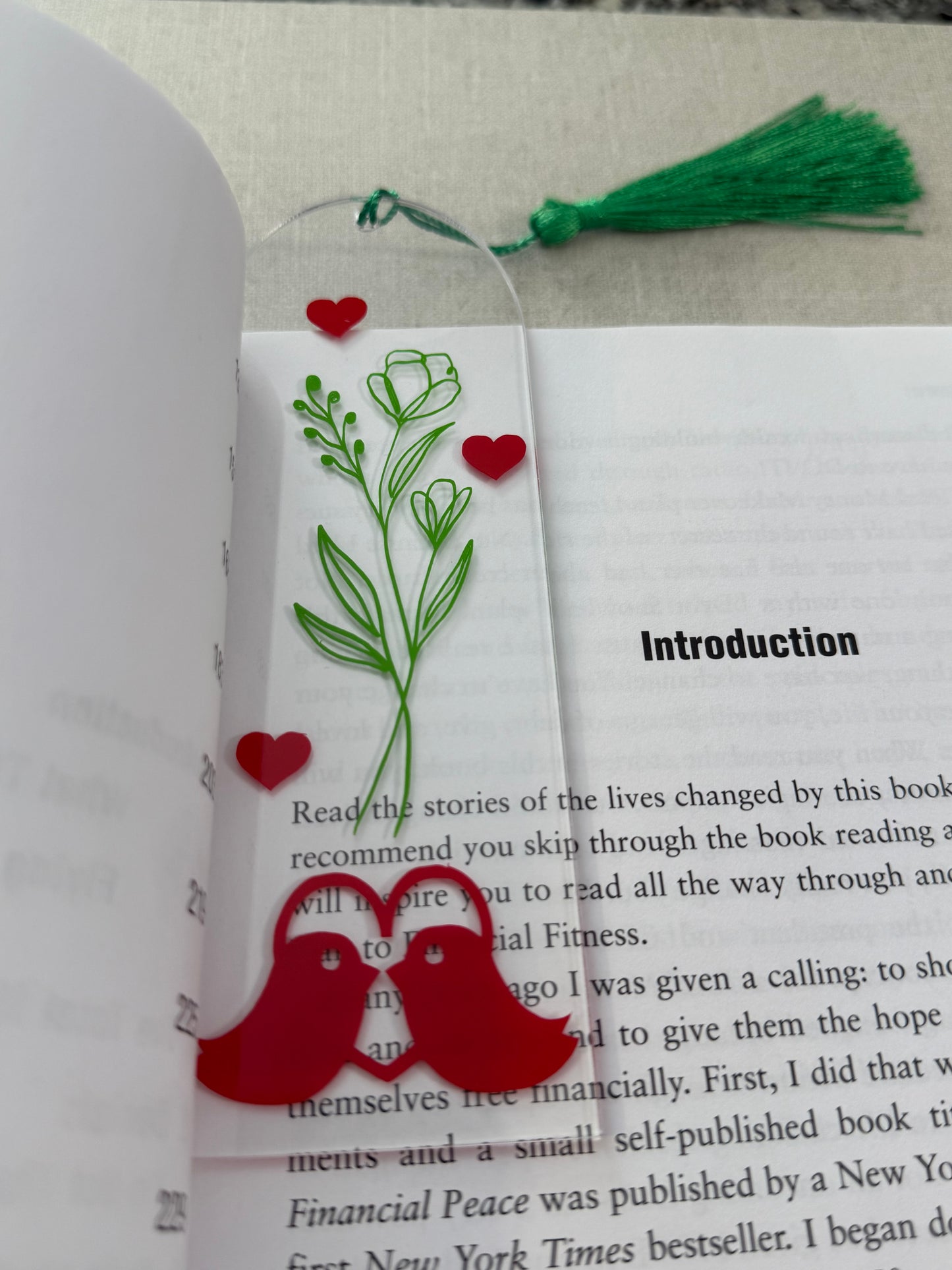 Acrylic bookmark with green flowers, red love birds, and a green tassel Roxzell