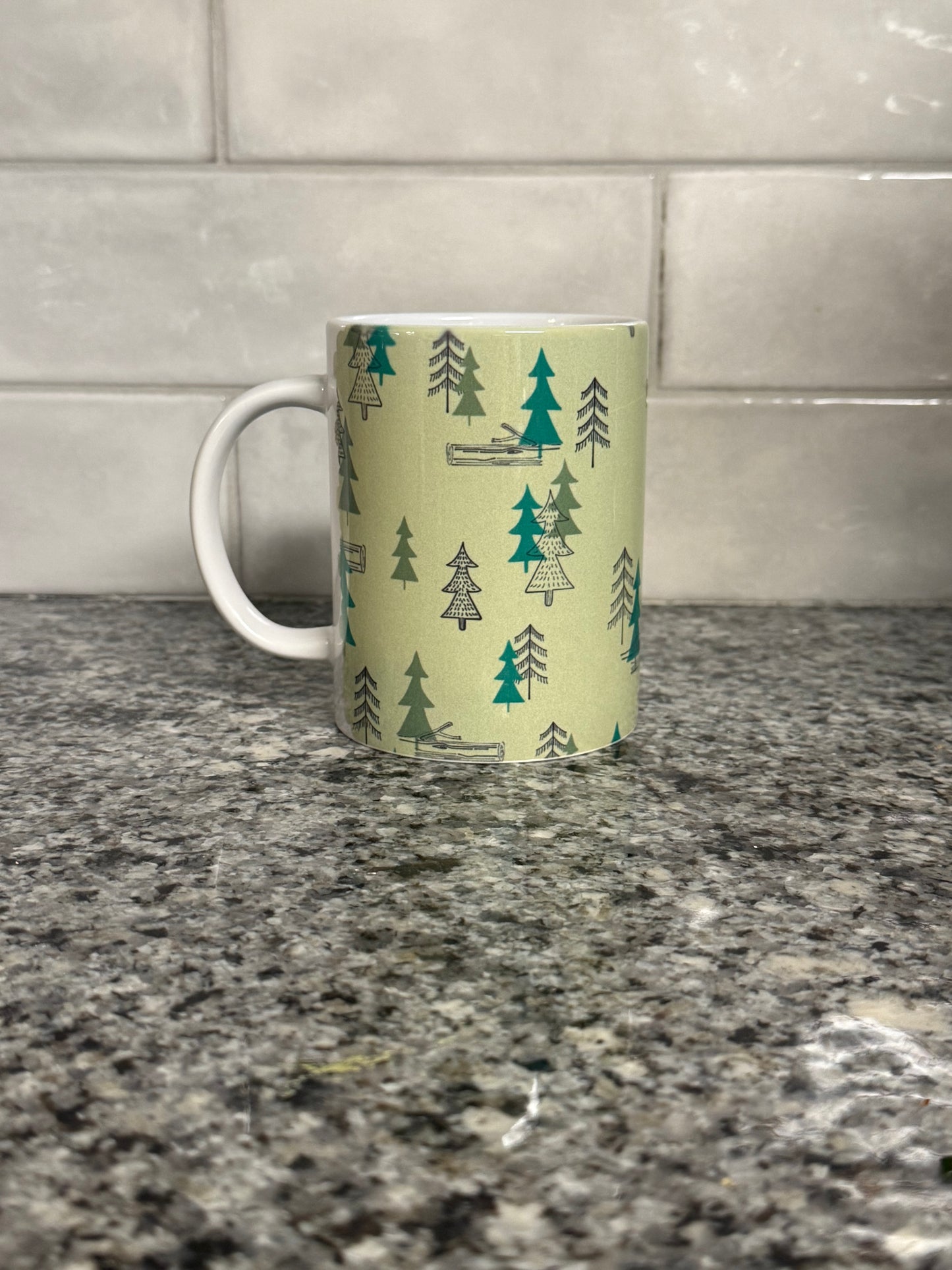 12 oz coffee mug with camping site forest trees design.