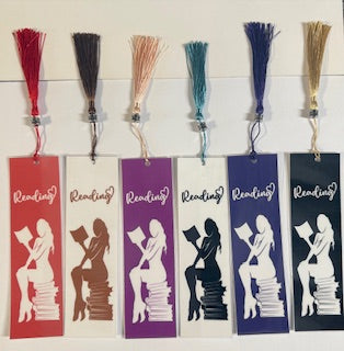 Set of colorful bookmarks with a design of a person reading a book, each labeled 'Reading'.