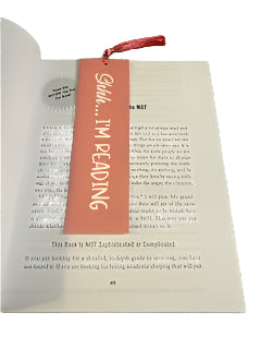 Book with a pink bookmark labeled 'Shhh... I'm reading' on a white background.