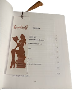 White bookmark with brown silhouette of woman reading .