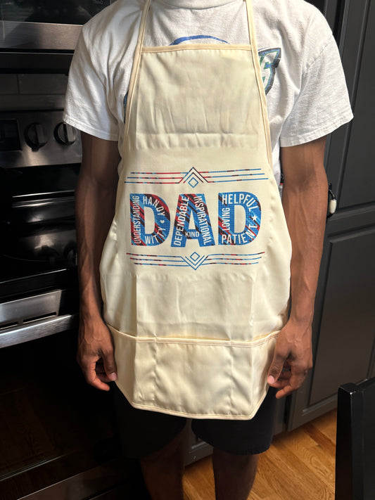 Man wearing red and blue DAD apron while cooking in the kitchen, Roxzell