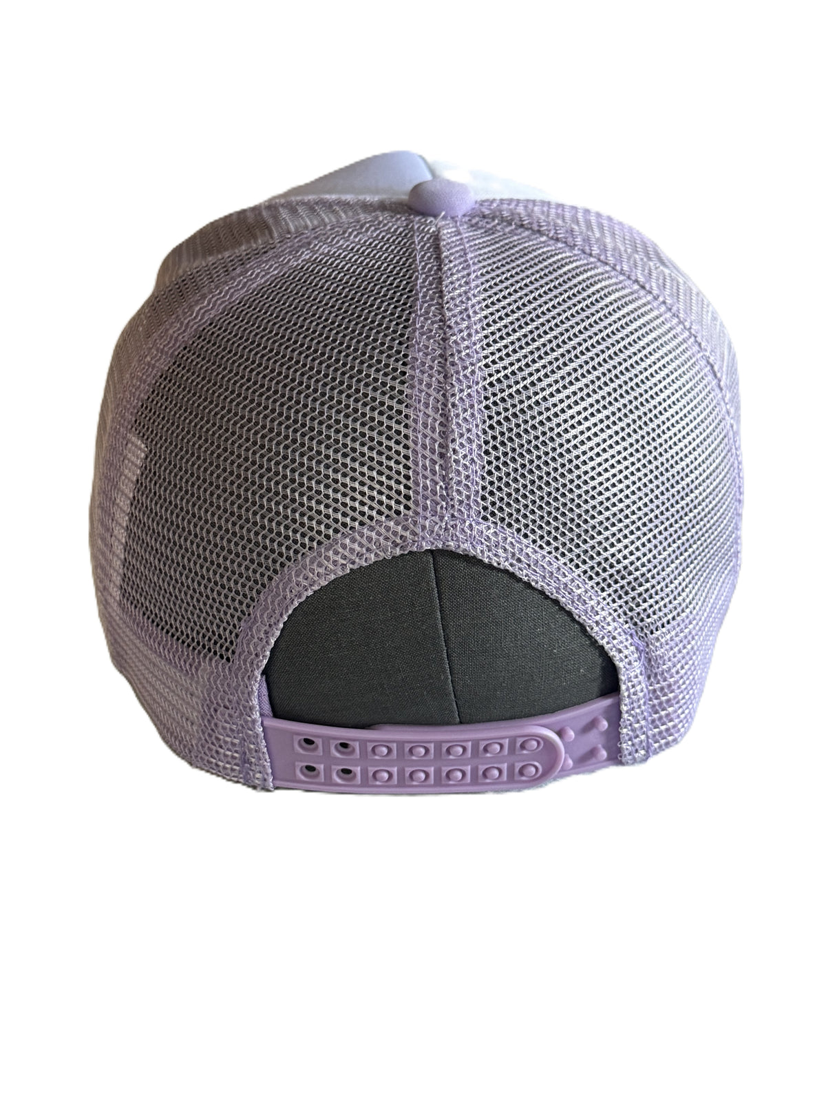 Back adjustable snap closure view of a lavender and white trucker hat featuring a purple soccer-ball-patterned bow graphic and the number '10' printed on each side of the bow, shown against a plain white background. Roxzell