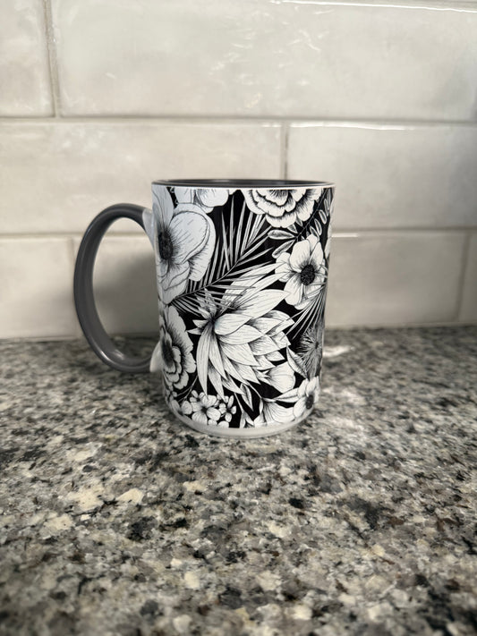 Beautiful 15 oz mug with black and white botanical flower.  Mug has a gray interior and gray handle.