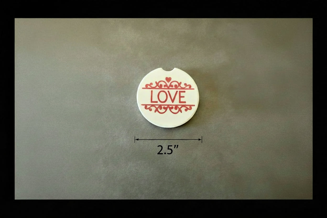 White faith-inspired car coaster with “LOVE” message on a black and gray background with 2.5" measurement arrow below the car coaster, Roxzell