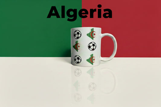 White ceramic mug featuring Algeria’s map in green with crescent and star emblem beside soccer ball graphics on a green, red, and off-white background with the word "Algeria" at the top. Roxzell
