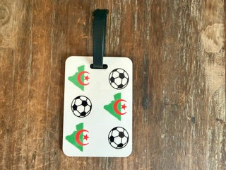 Algeria soccer luggage tag with black strap on wooden surface. Roxzell