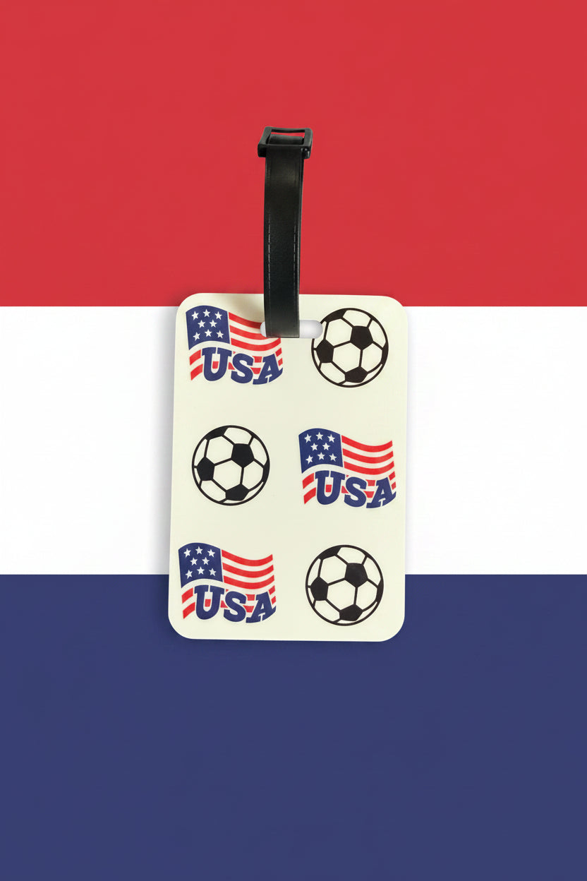 USA soccer luggage tag with black strap on red, white, and blue background. Roxzell