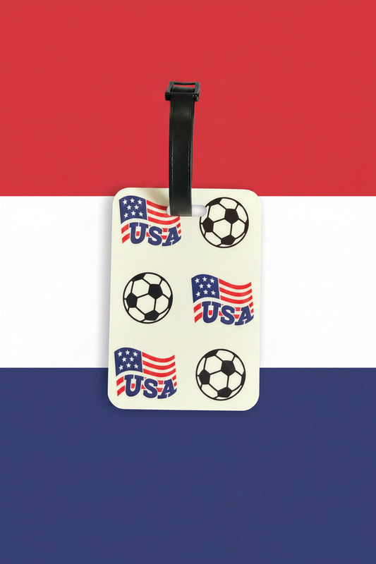 USA soccer luggage tag with black strap on red, white, and blue background. Roxzell