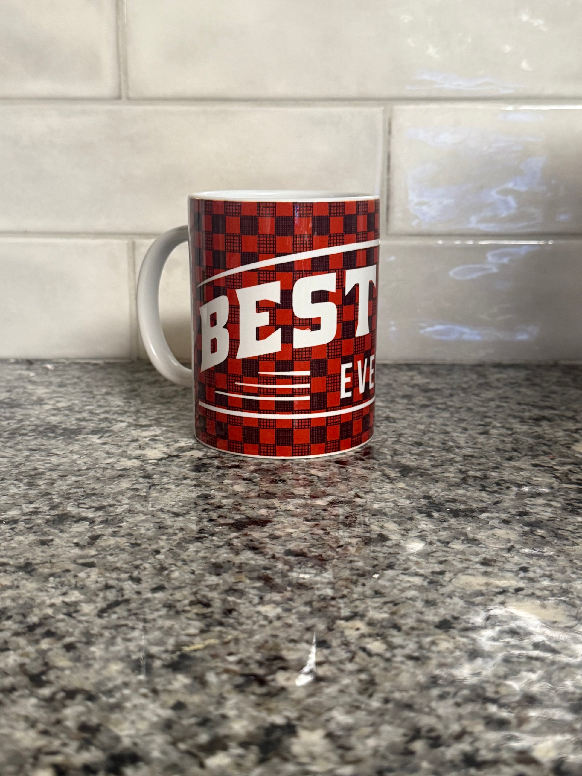 Red and Black checkered coffee mug with 'BEST DAD EVER' design.