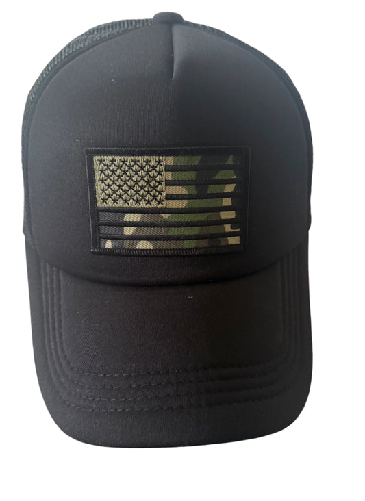 All black trucker cap with cam flag patch on the front, mesh back and adjustable snap closure.