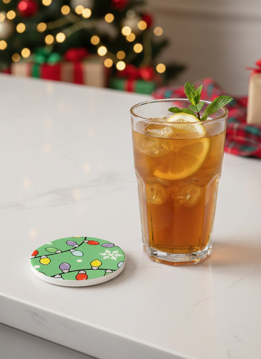 Christmas lights coaster beside a glass of iced tea with lemon and mint, Christmas tree and presents in the background, Roxzell