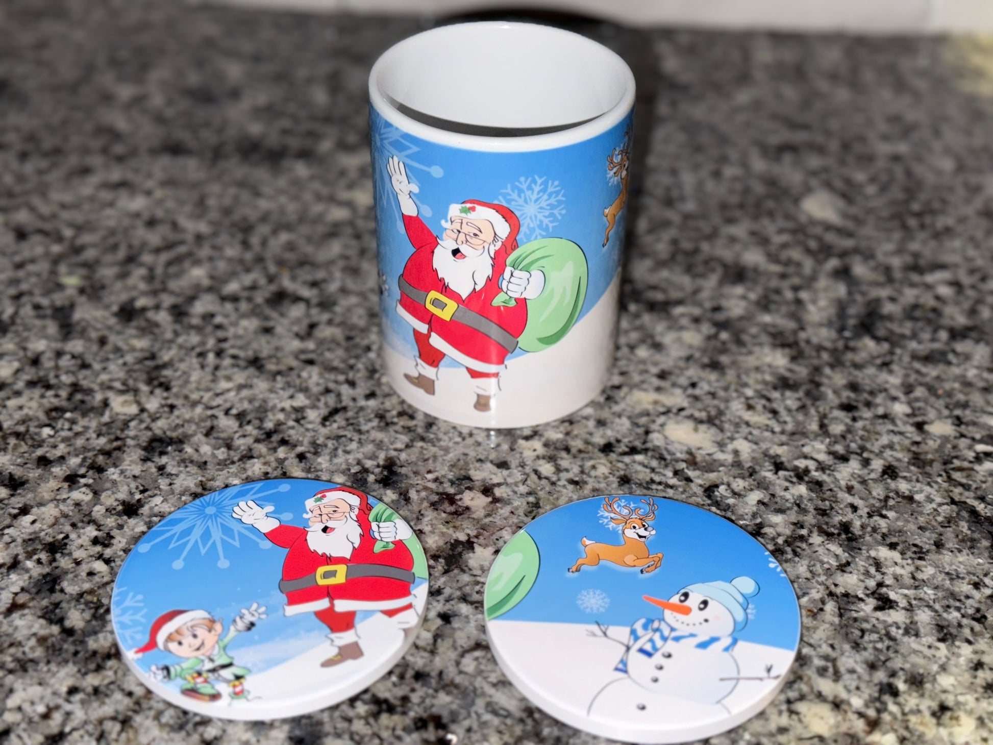 Christmas-themed coffee mug and coaster design on a granite countertop