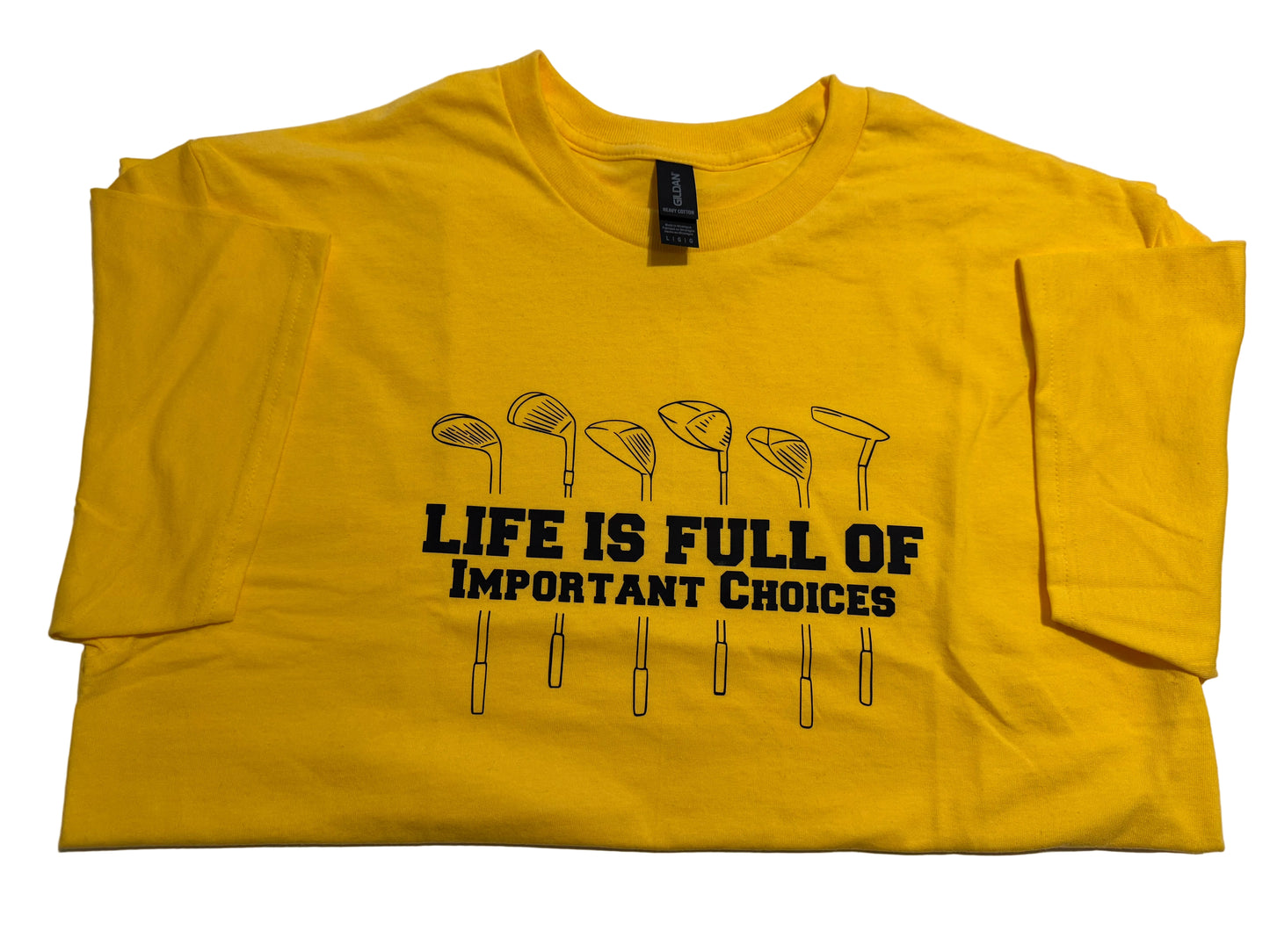 Close-up of seven golf club graphic and Life Is Full of Important Choices bold navy blue lettering on bright yellow cotton t-shirt 