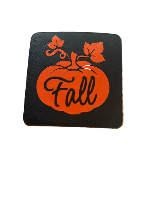 Square black leather coaster with the word Fall written in an orange pumpkin, Roxzell