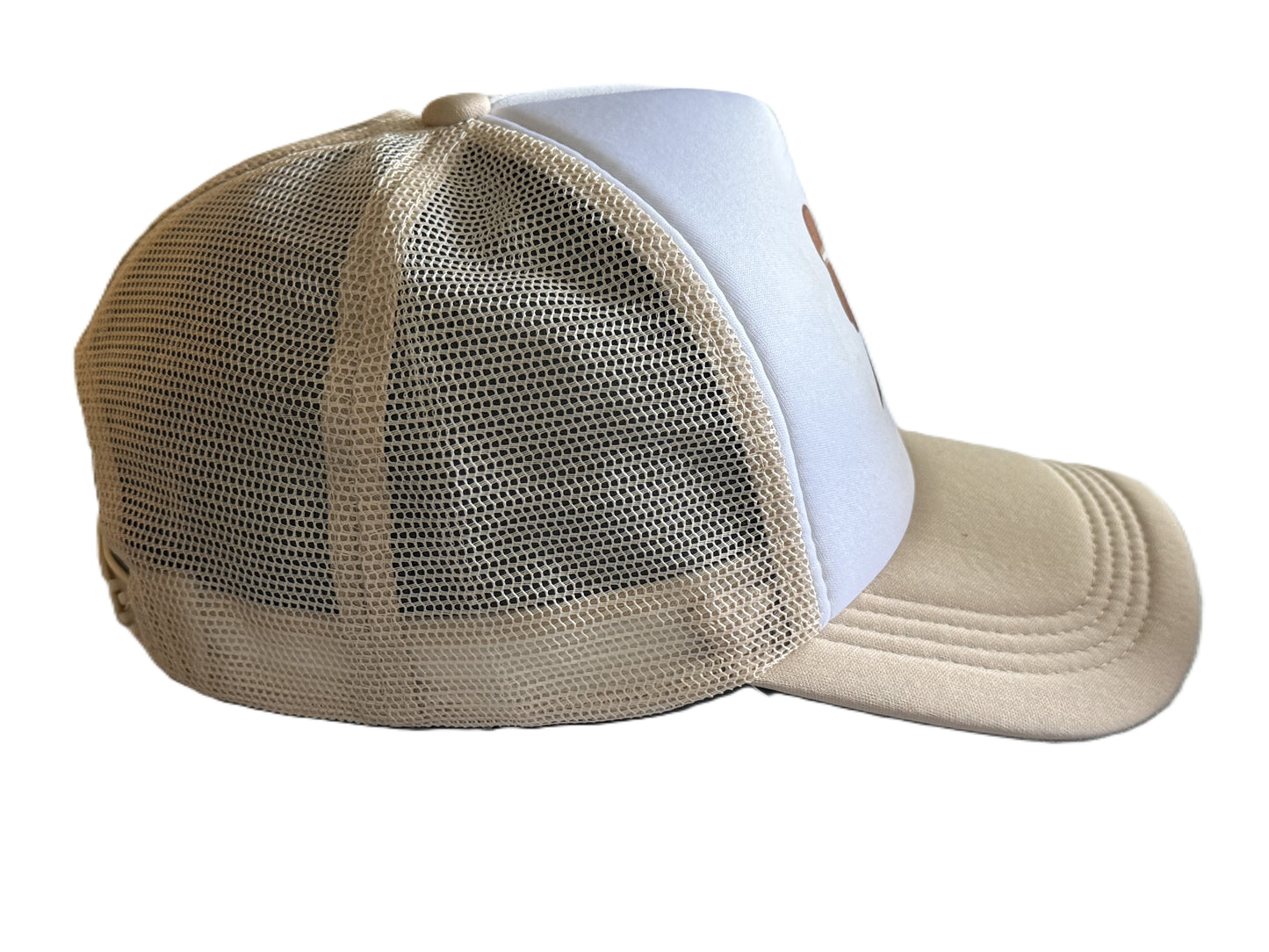Right side view showing beige mesh and curved brim of the football bow trucker hat. Roxzell