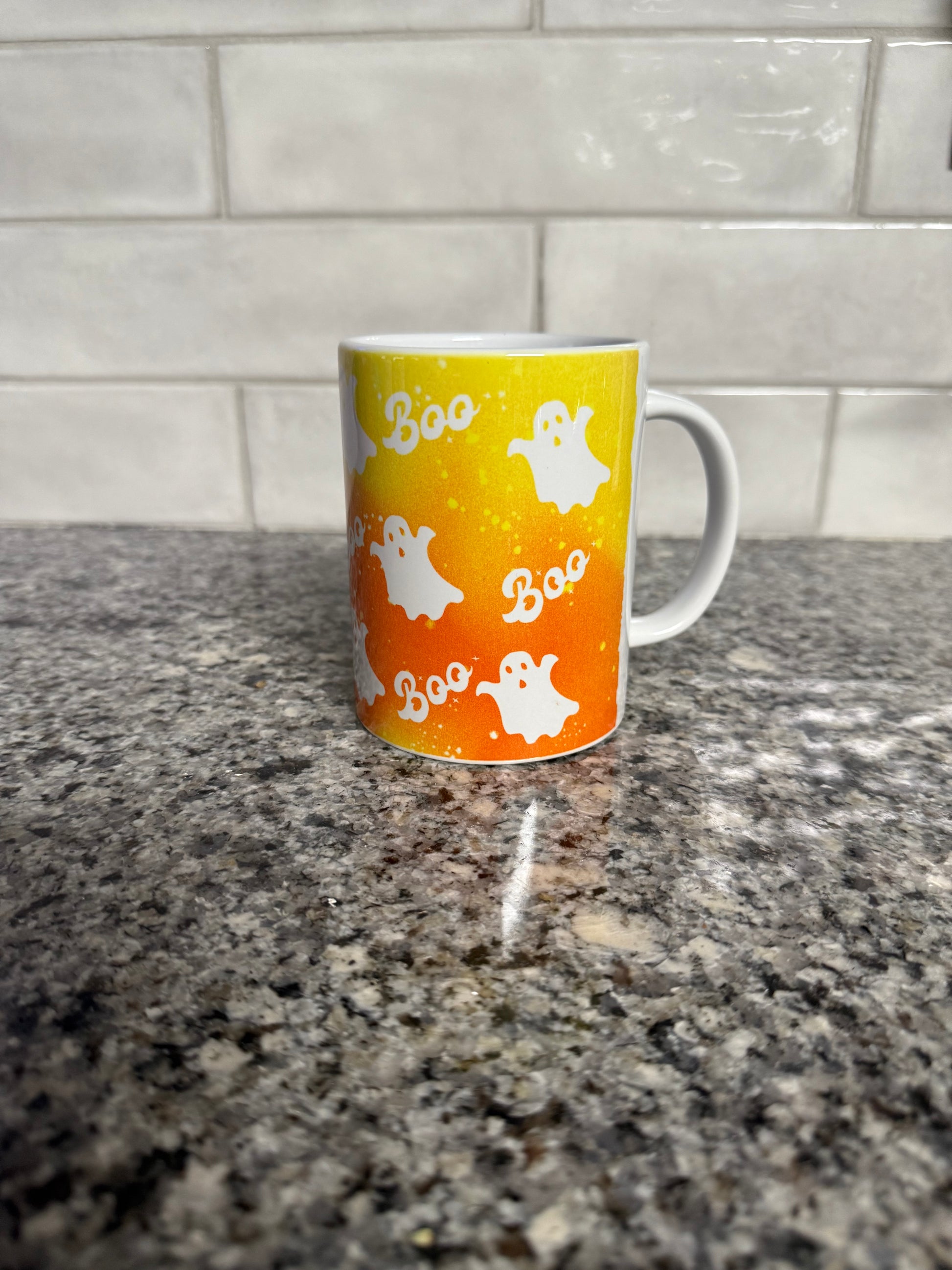 Orange and white Halloween mug with ghosts and the "Boo" in the design, Roxzell