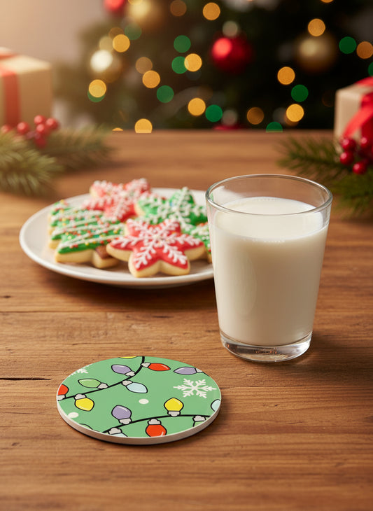 Ceramic drink coaster with colorful Christmas lights and a snowflake on a table beside a glass of milk and Christmas sugar cookies, Roxzell