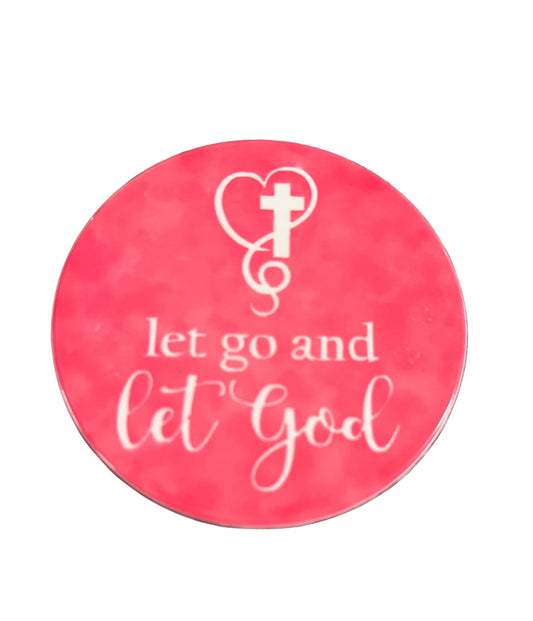 Round bright pink coaster with 'let go and let God' text and cross surrounded by a heart Roxzell