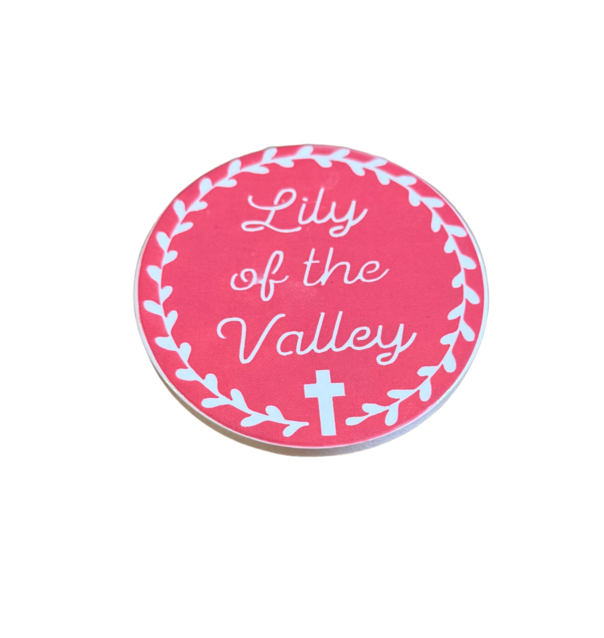 Pink Lily of the Valley Coaster with a leaf boarder and a cross at the bottom on a white background.