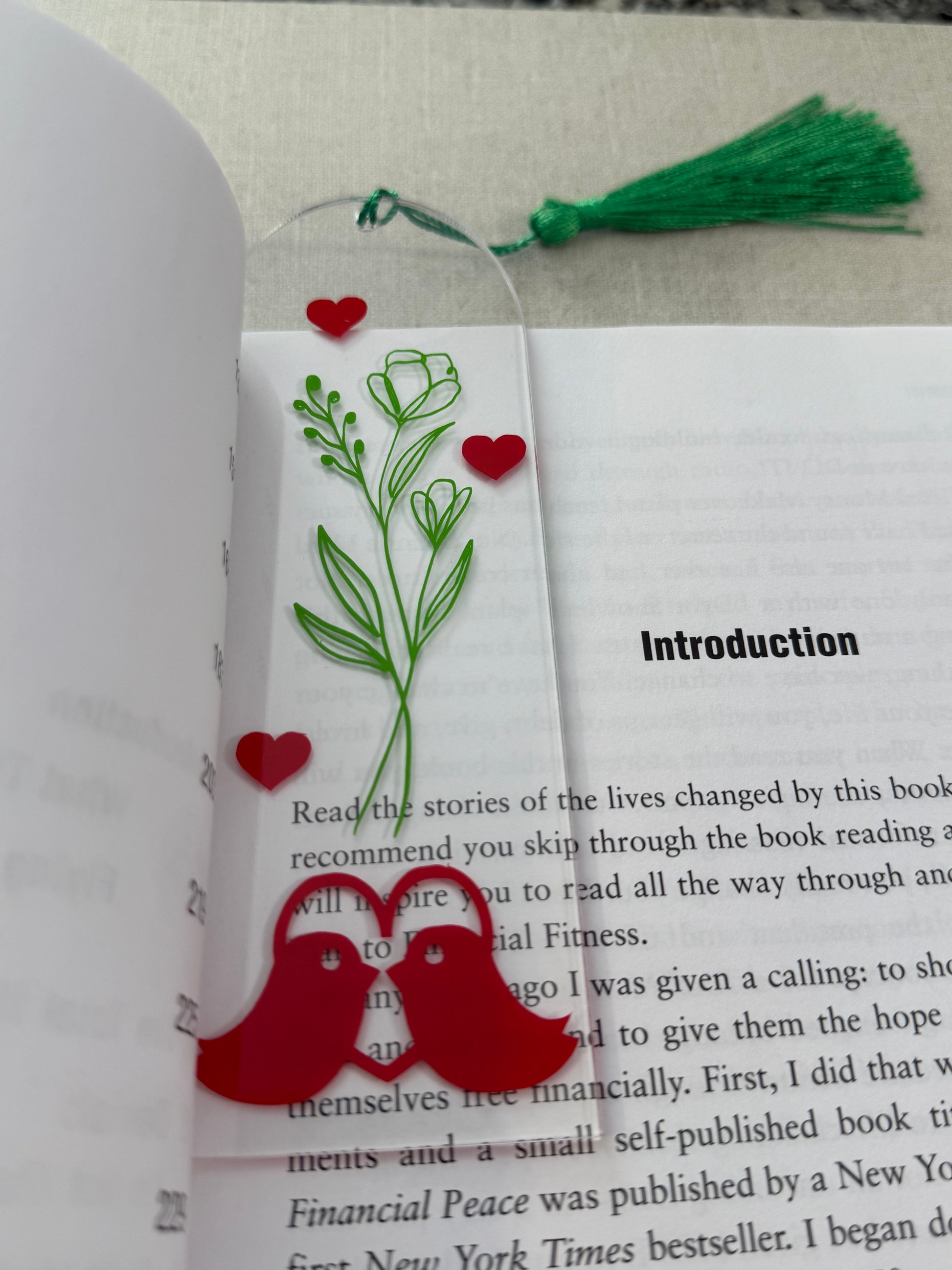 Acrylic bookmark with green flowers, red love birds, and a green tassel Roxzell