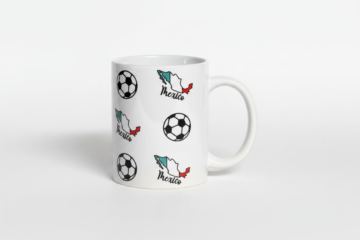 Glossy white mug featuring Mexico’s flag colors and soccer ball motifs, celebrating national football pride. Roxzell