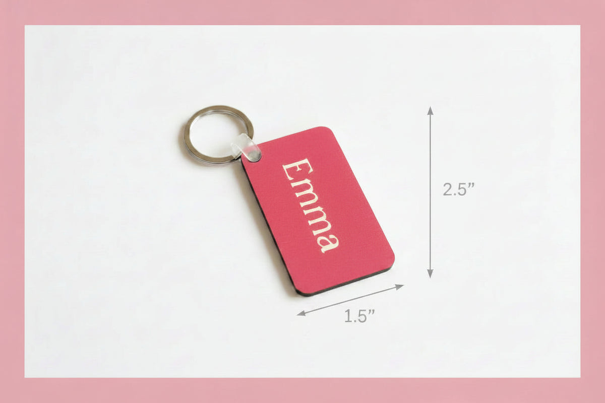 Personalized Emma keychain with white name print on a white background with a pink border. RoxzRoxzell
