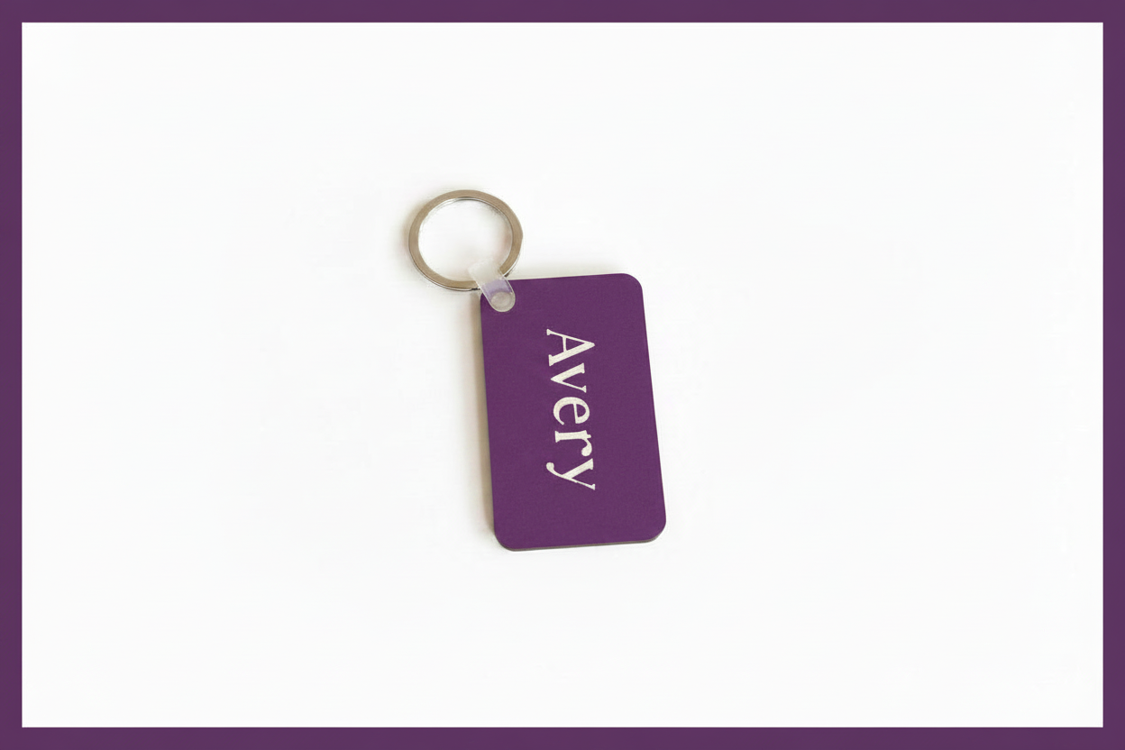 Personalized purple keychain with name Avery in white print on a white background with a purple border Roxzell