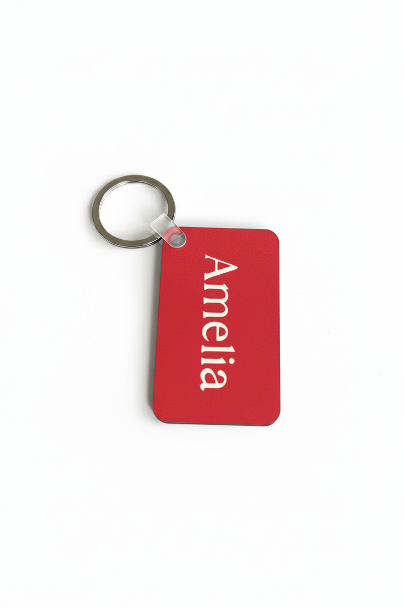 Red personalized Amelia keychain with white name print. Roxzell