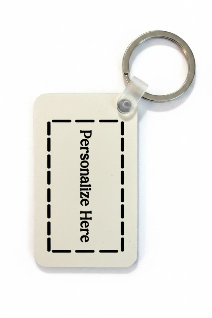 Rectangular keychain with text 'Personalize Here' on a white background. Roxzell