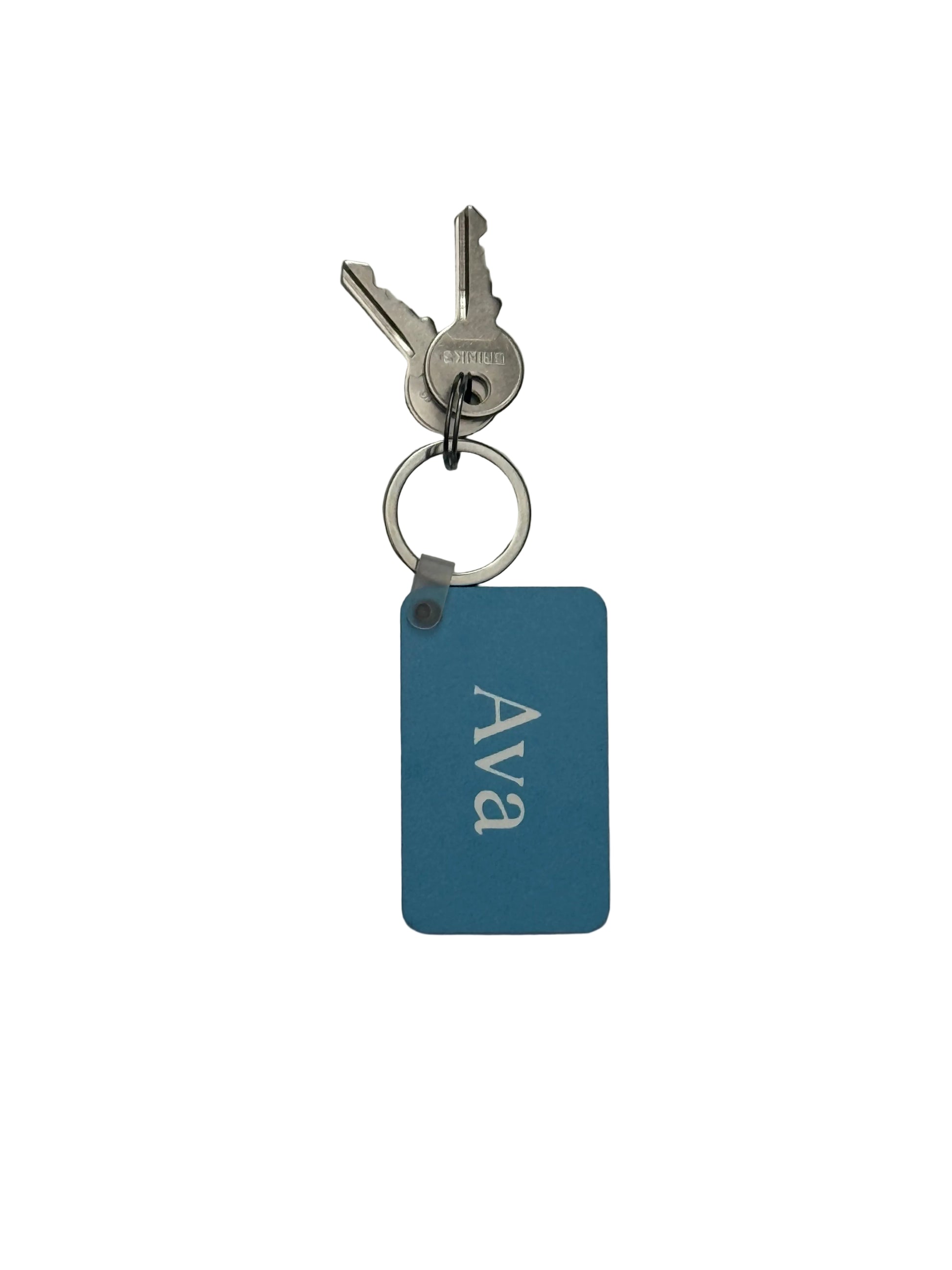 A personalized blue key chain with the name 'Ava' in white, attached to a split key ring with two silver keys, on a plain white background. Roxzll