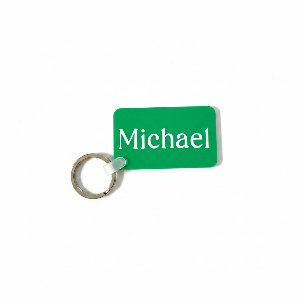 Green personalized keychain with name 'Michael' on a white background. Roxzell