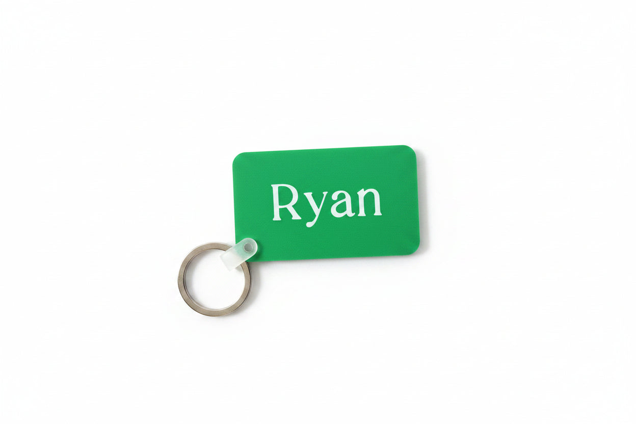 Green personalized keychain with name 'Ryan' on a white background. Roxzell