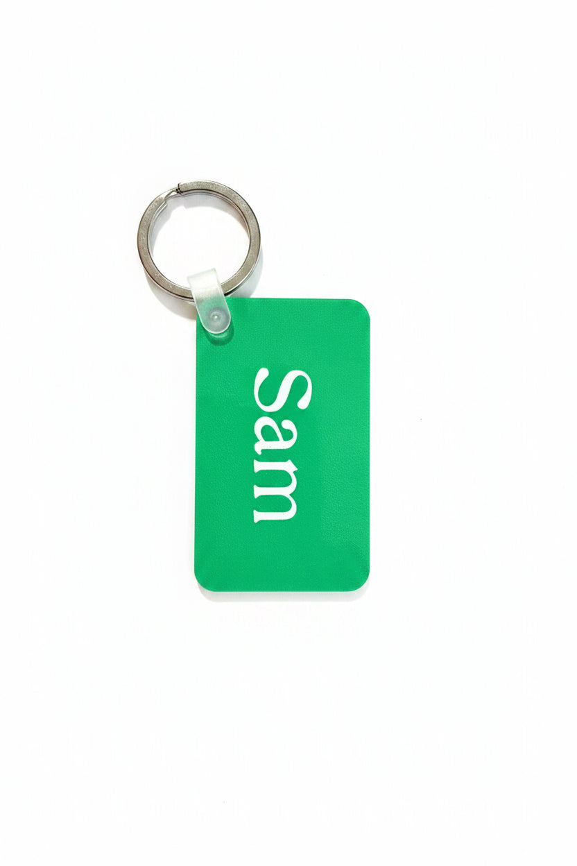 Personalized Keychain, green with name 'Sam' on a white background. Roxzell