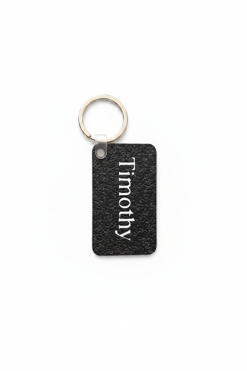 Personalized black speckle keychain with name Timothy in white.  Roxzell