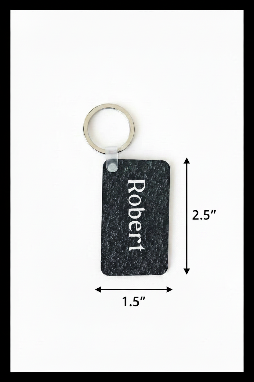 Personalized keychain with name 'Robert' printed in white with dimension arrows of 2.5" on the right side and 1.5" below the keychain on a white background with black border. Roxzell