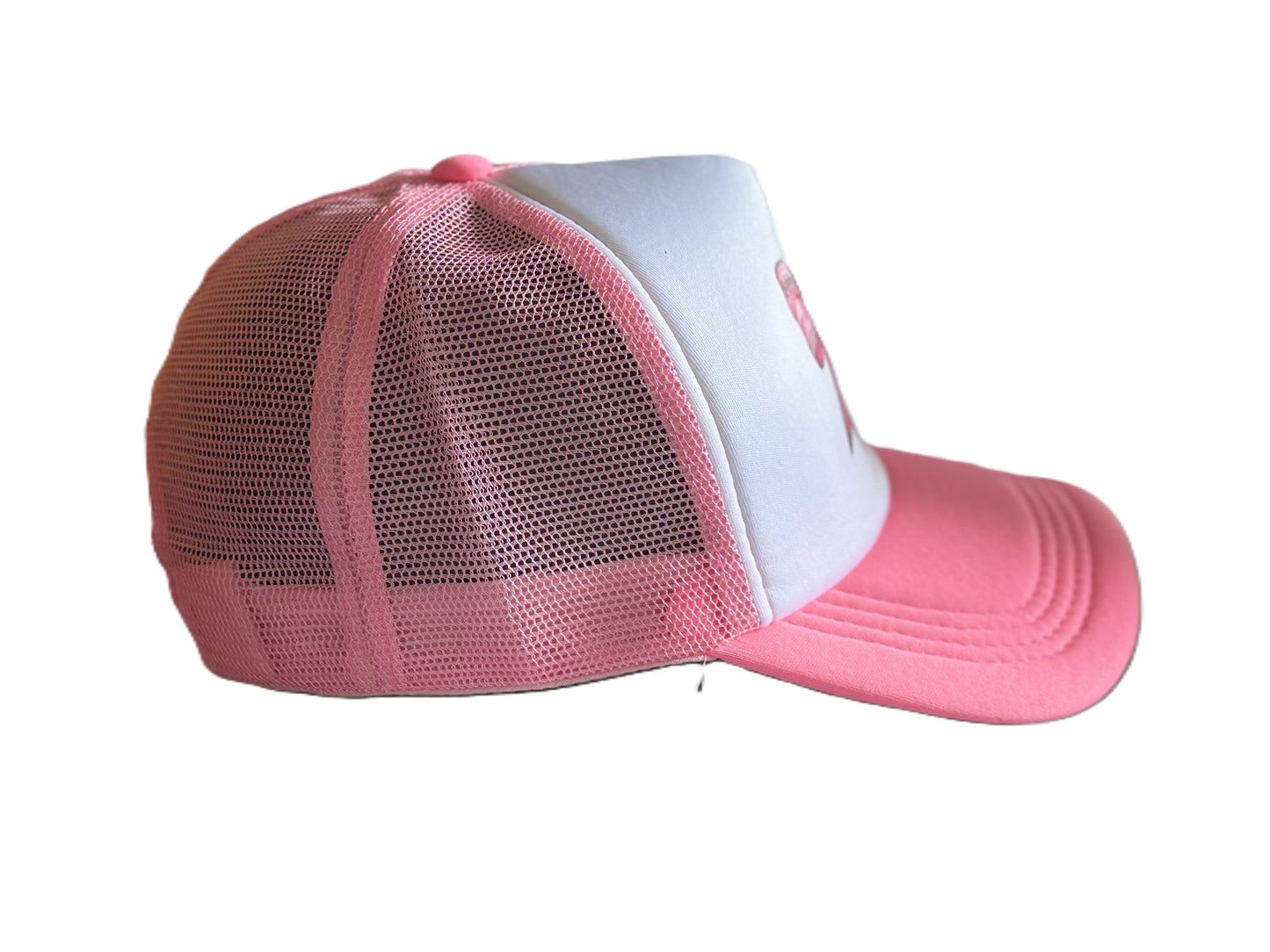 Right side view of the pink bow trucker hat showing the curved brim, white front panel, and pink mesh back. Roxzell