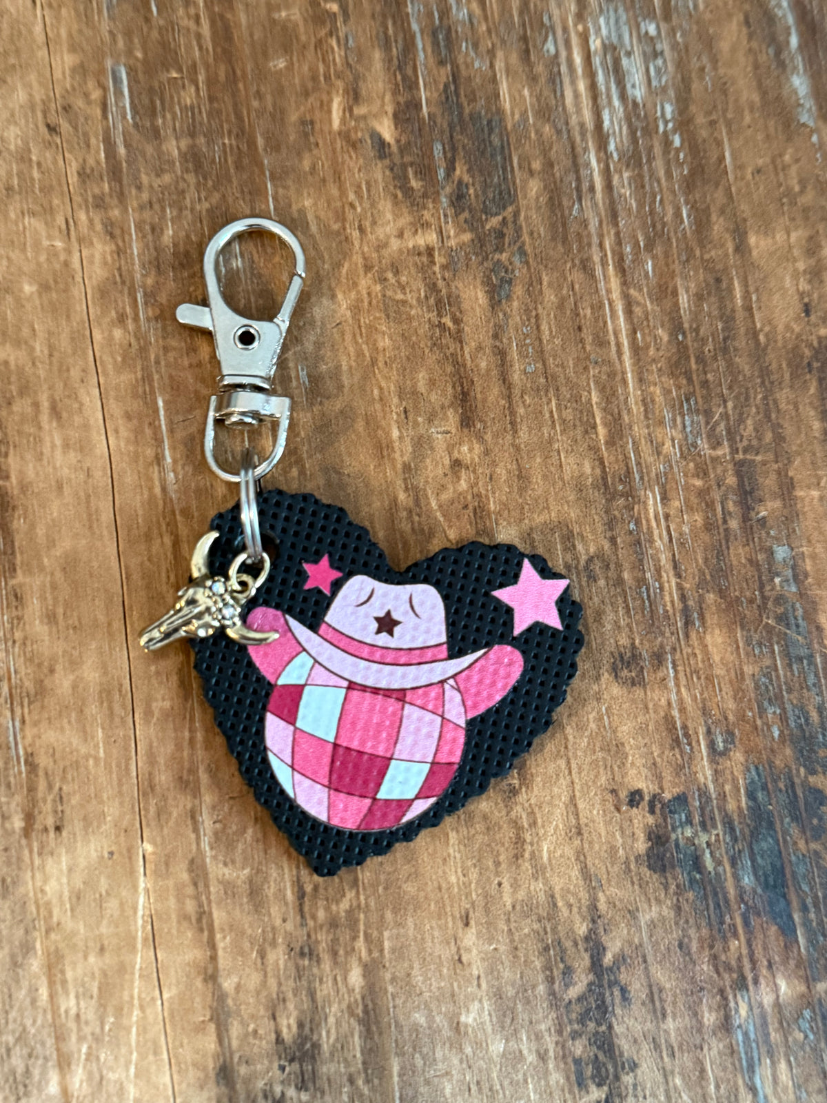 Heart-shaped Western bag charm with pink checkered design, cowgirl hat, and clip